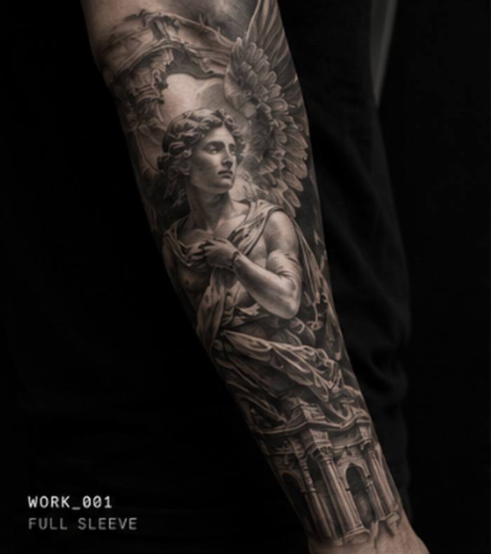 Black and grey realism tattoo of a winged angel figure, full forearm sleeve